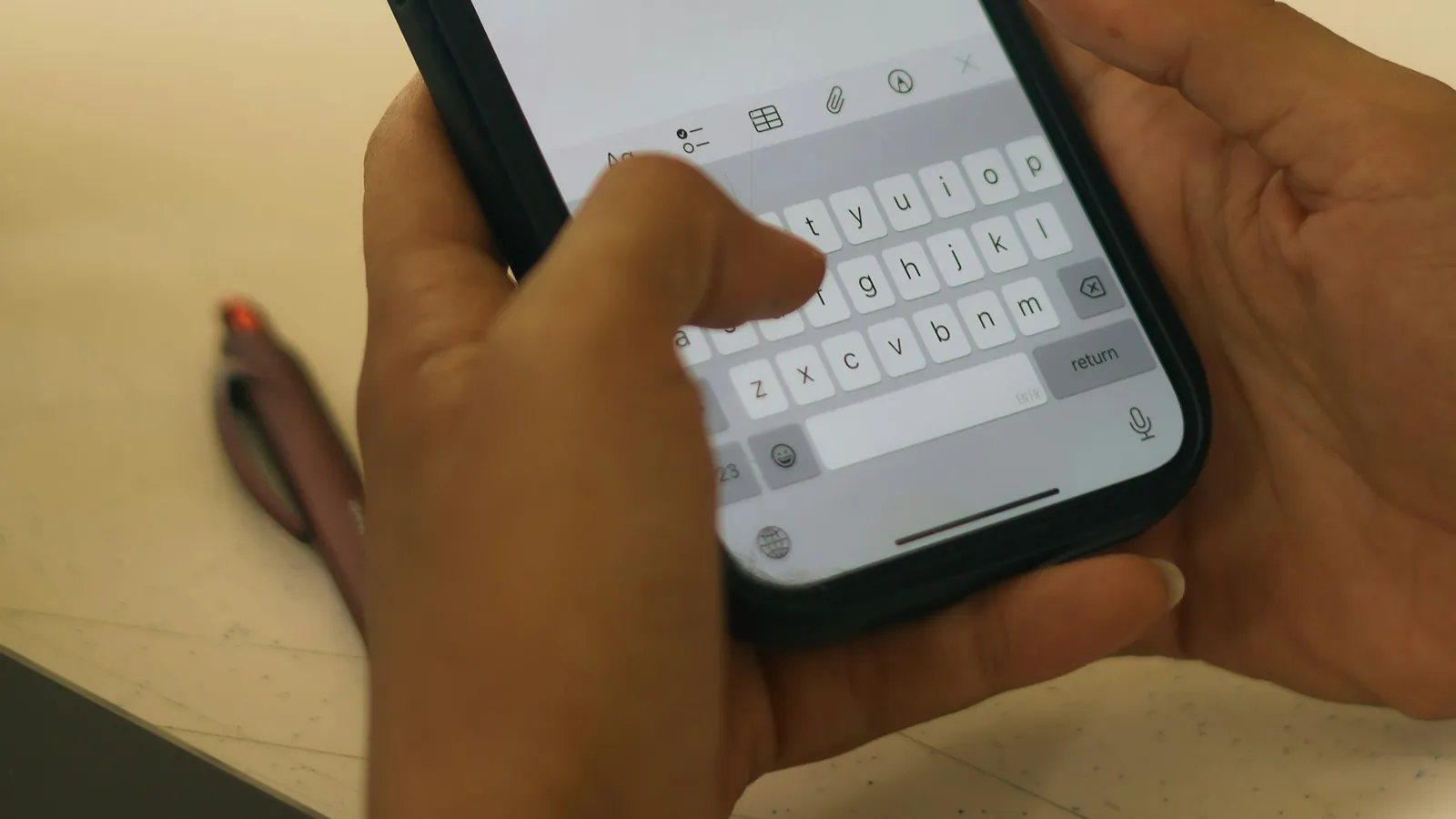 Hands typing a message on a phone, the conversation sentiment analysis reads